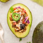 Taco Stuffed Avocado Cups - a fun appetizer based on the classic Mexican favorite and perfect for parties. Best of all, this recipe is gluten free, keto and low-carb friendly.