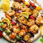 Grilled Lemon Shrimp Skewers with Vegetables coated with a buttery garlic lemon sauce. Low carb, keto and perfect for patio season.