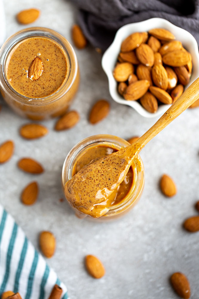How to make Homemade Almond Butter – Learn how easy it is to make healthy and delicious homemade almond butter using your food processor or high speed Vitamix blender. It comes together quickly and makes a delicious snack alternative to peanut butter.