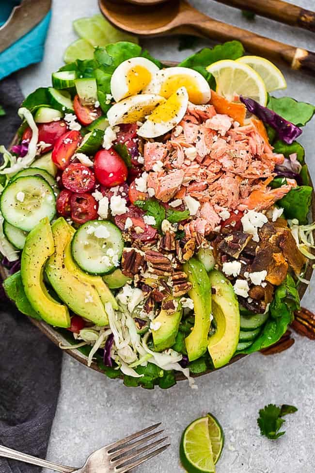 Keto Salmon Salad - a delicious loaded meal made with grilled or broiled salmon, cucumber, eggs, tomatoes, avocado, crispy bacon and a creamy and tangy vinaigrette. Low carb, keto , gluten free with Whole 30 & paleo friendly options.