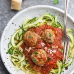 Zoodles with Meatballs – the perfect low carb / keto-friendly gluten free “pasta” dinner. Made with a homemade or jarred marinara sauce and spiralized zucchini.