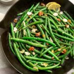 Top view of skillet green beans in a cast iron skillet