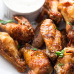 Close-up of keto chicken wings on a white plate